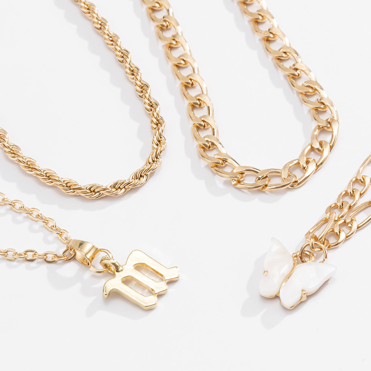 Butterfly & Letter Anklet Set – 4pcs